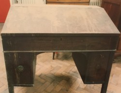 Before: a Georgian desk rescued from a chicken shed