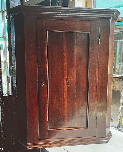 Georgian oak corner cupboard.